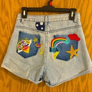 Jean shorts by Rumwe with Alien patch on butt and rainbow also. Small size 4